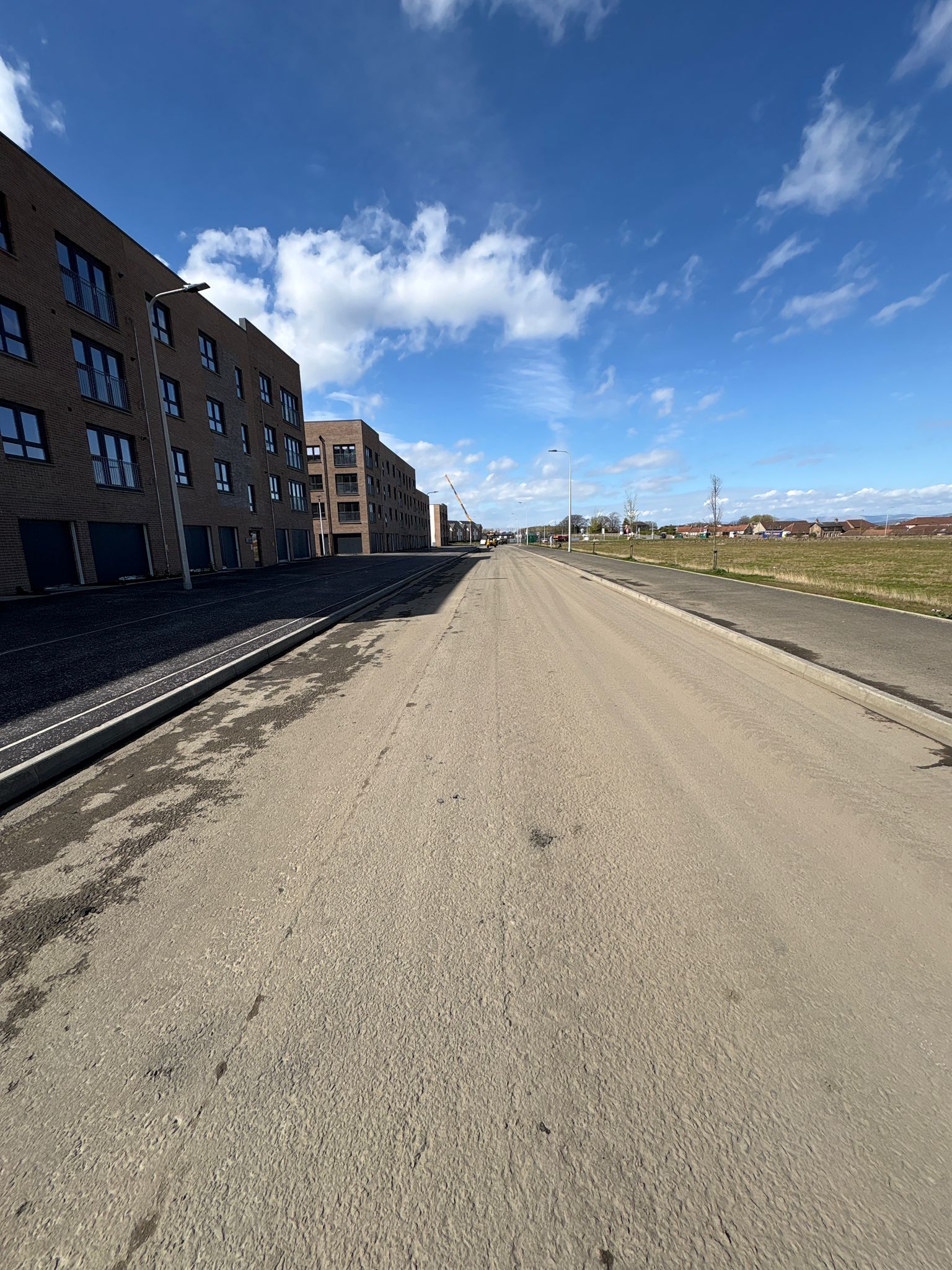 Prepared carriageway showing sub-base and alignment ready for final surfacing within the development