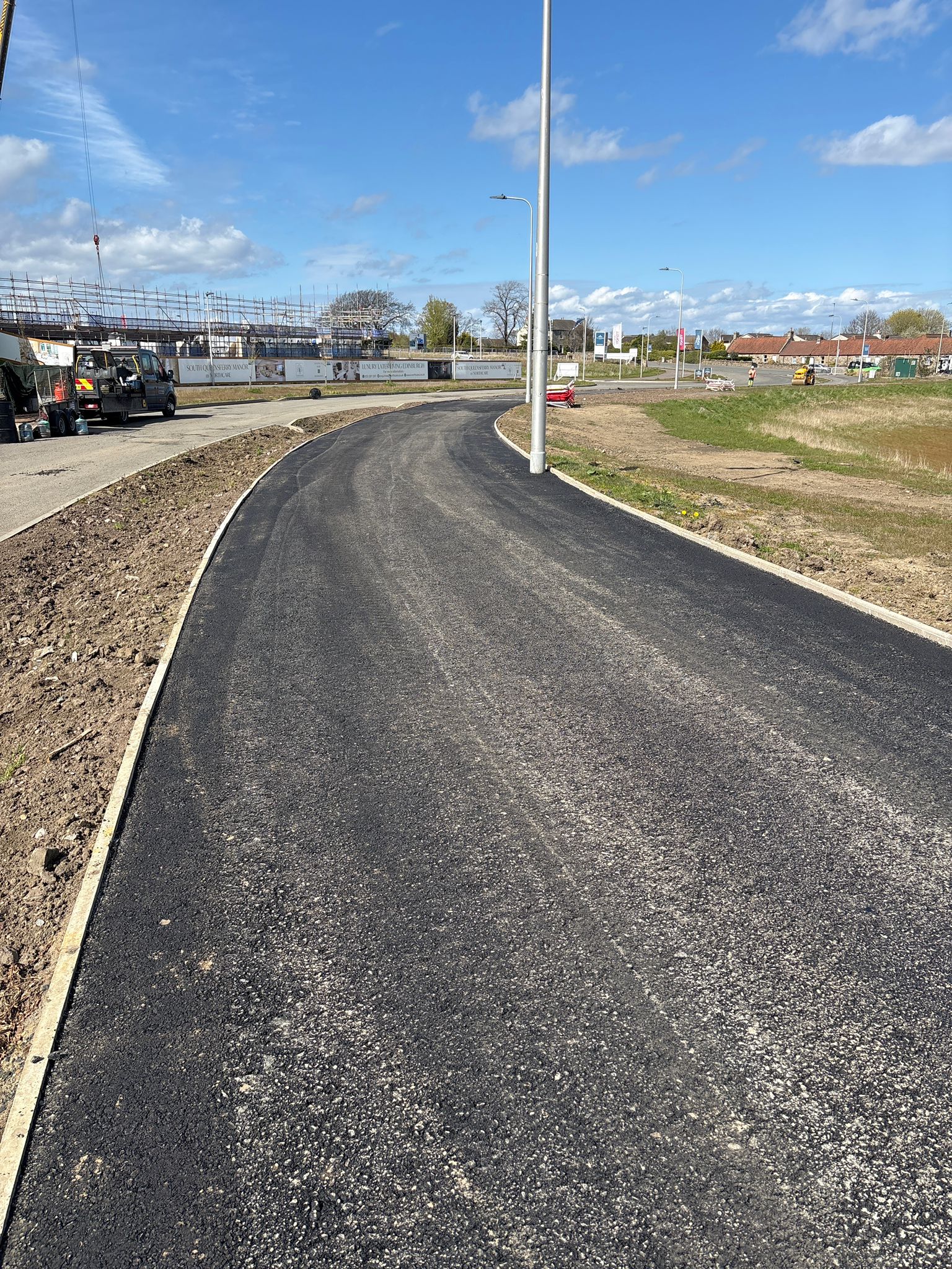 Extended footway alongside residential units showing continuity and alignment with street infrastructure