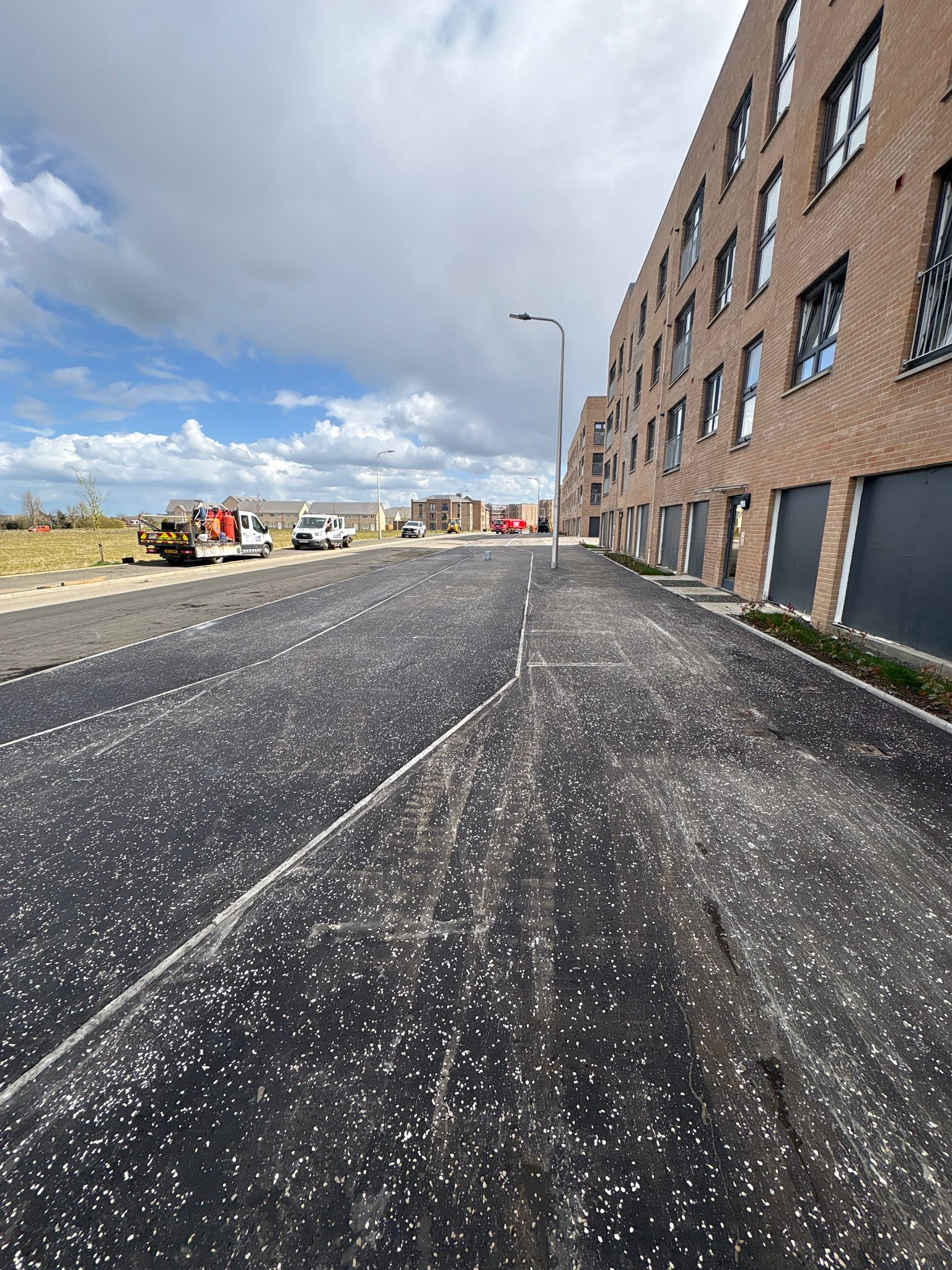 Completed footpath section integrated with surrounding landscaping and defined kerbing