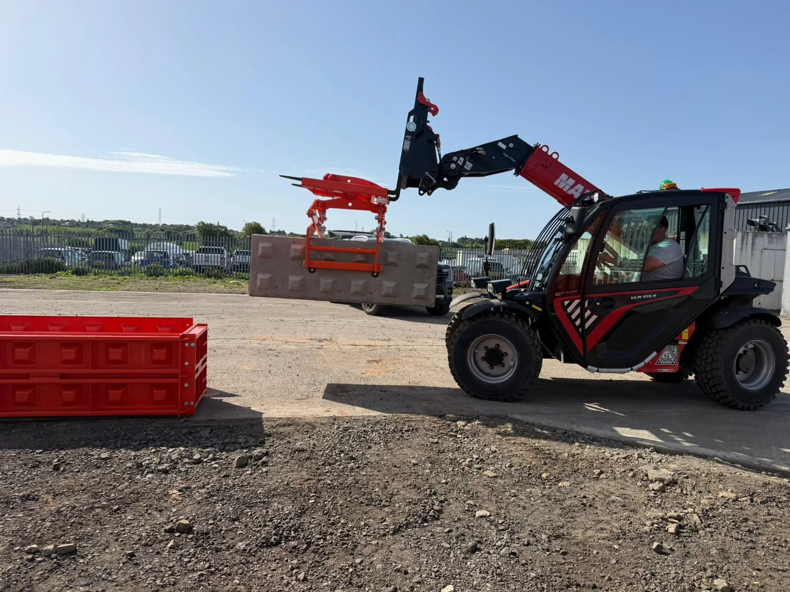 Lifting a Bonnie Blocks mould into position in the yard