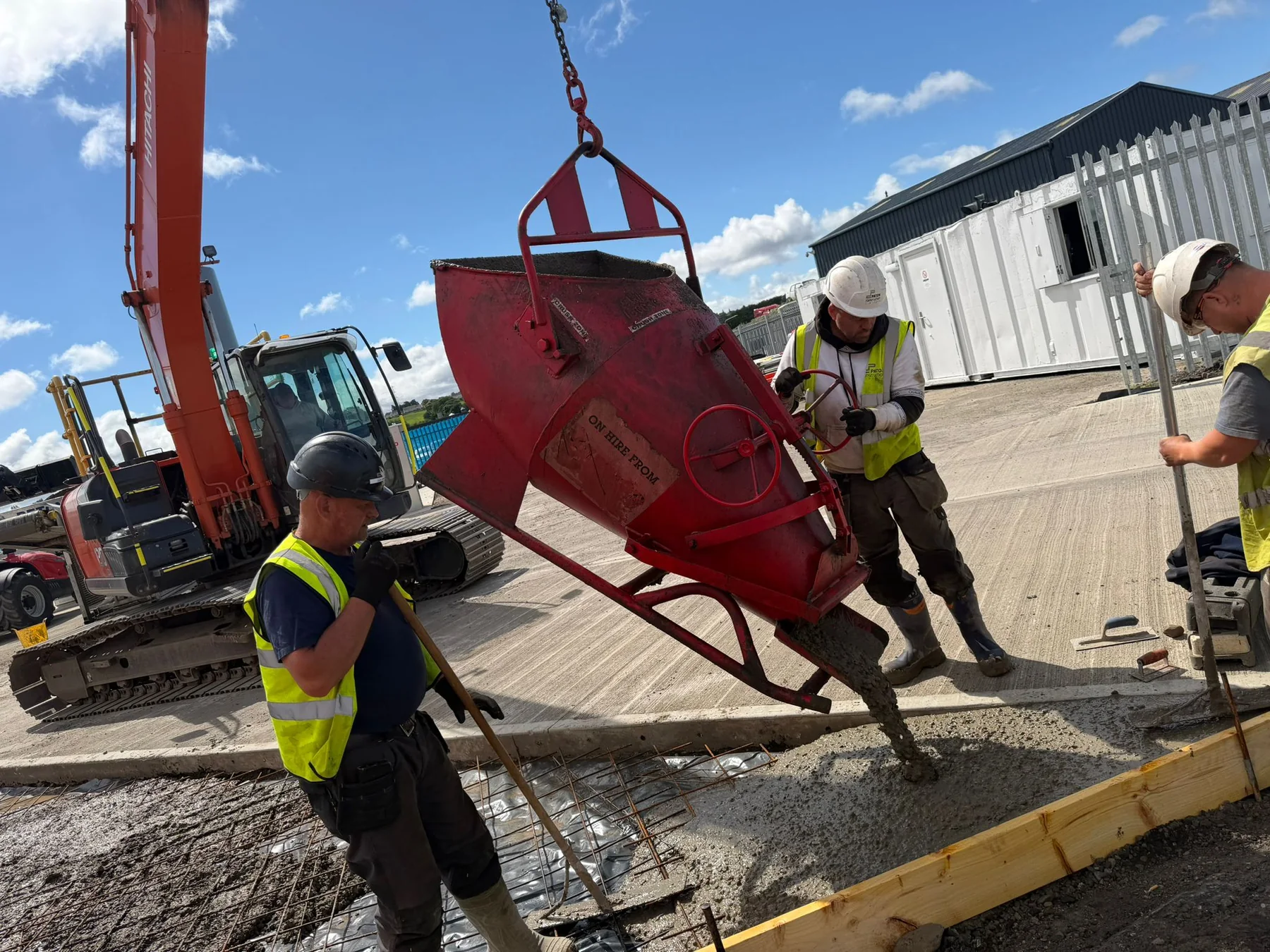 Yard team placing concrete during block production